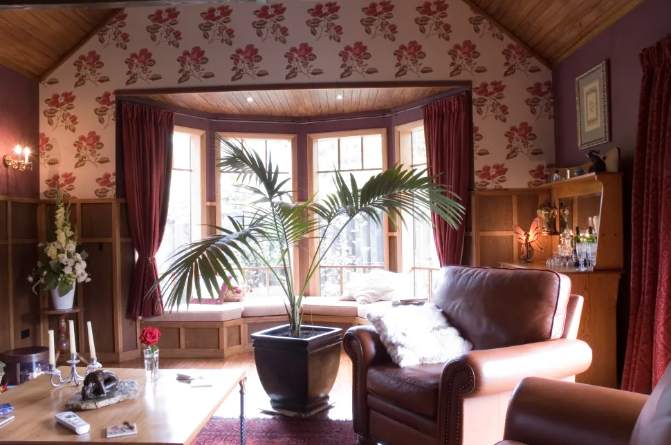 Davis Residence — living room with floral wallpaper and bay window