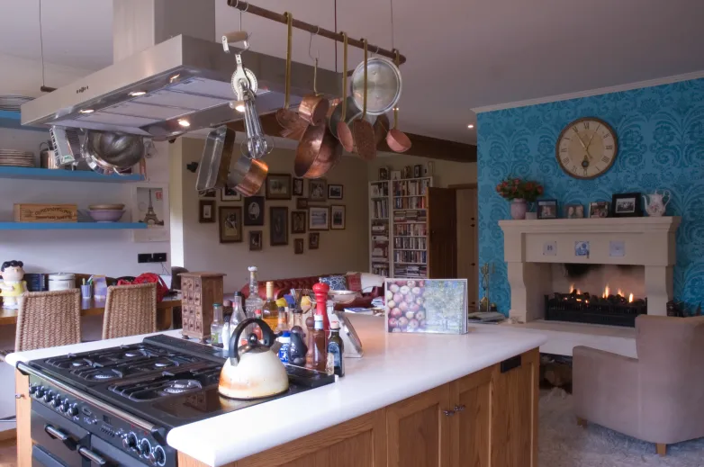 Davis Residence — kitchen with island and hanging copper pans