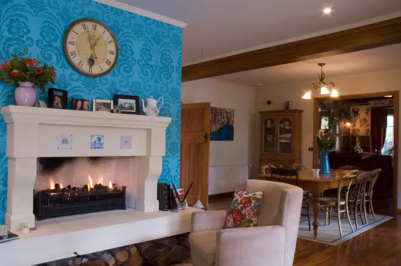 Davis Residence — living area with blue feature wall and fireplace