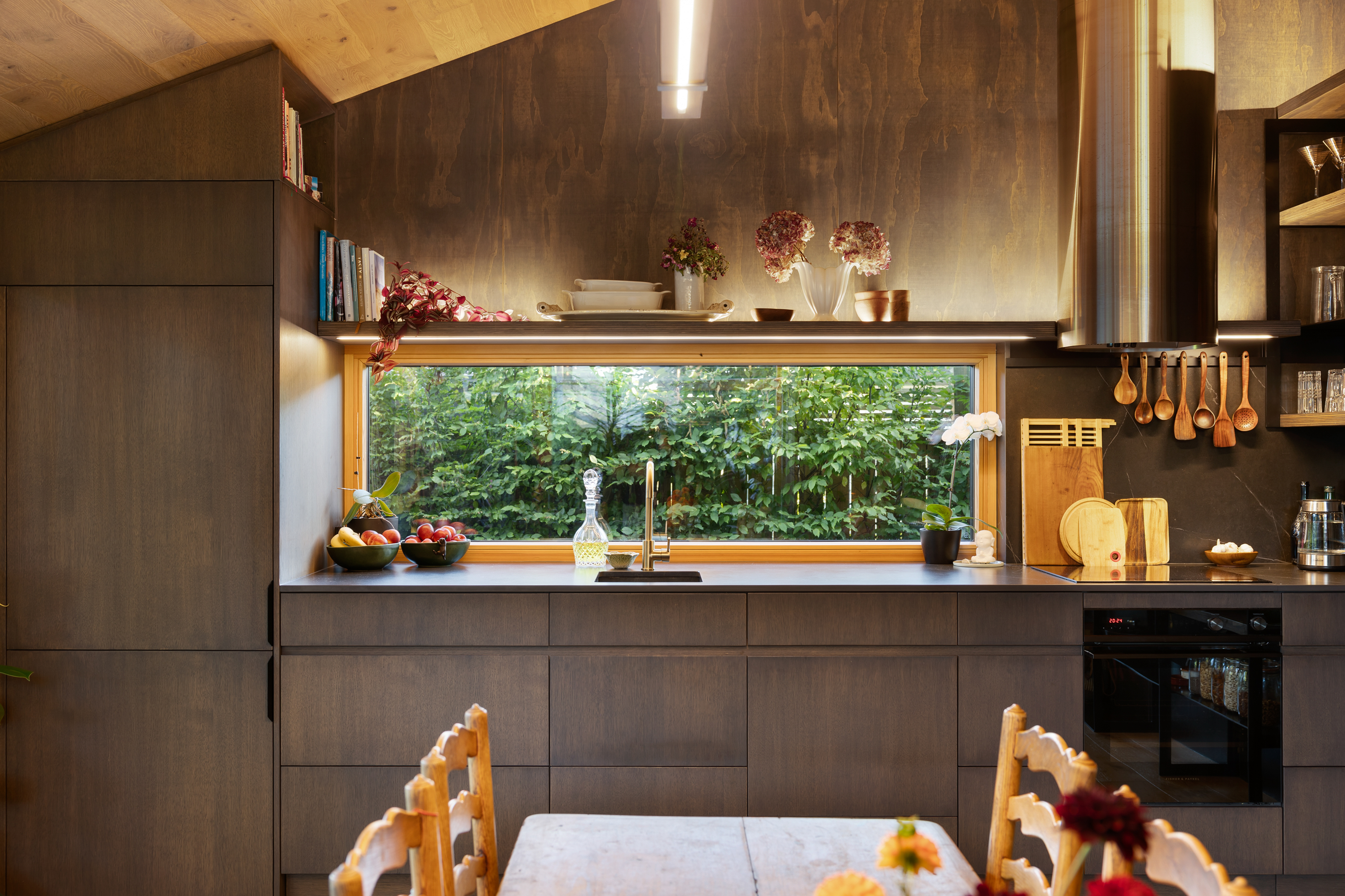Garden House — galley kitchen with timber joinery and a long garden window