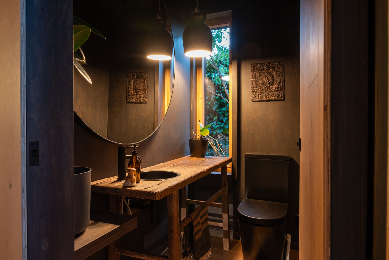 Garden House — powder room with reclaimed-timber vanity and round mirror