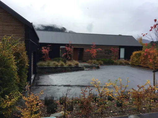 Speargrass Flat Residence — entry courtyard and schist paving