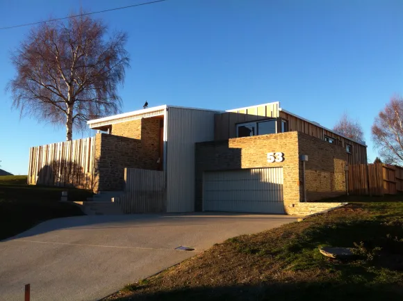Warburton House — exterior with cedar cladding and stone